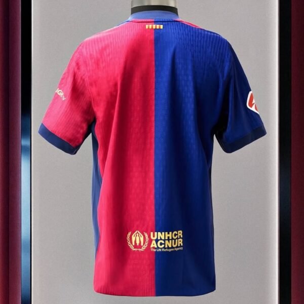 Limited edition FC Barcelona x Travis Scott 2024/25 home jersey featuring Blaugrana stripes, Cactus Jack logo, and Nike Dri-FIT fabric – exclusive football and streetwear collaboration